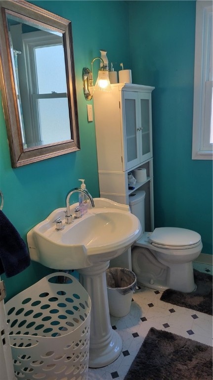 bathroom with tile patterned floors and toilet