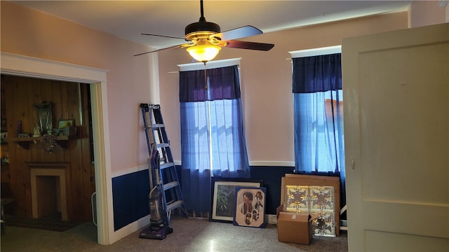 interior space with ceiling fan