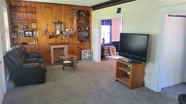 living room featuring carpet and wooden walls