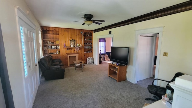 2601 Mount Royal Blvd, Shaler, PA 15116 - living room with a ceiling fan, carpet, wooden walls, and ornamental molding