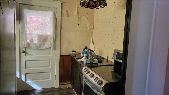 kitchen featuring white electric range oven and dark hardwood / wood-style flooring