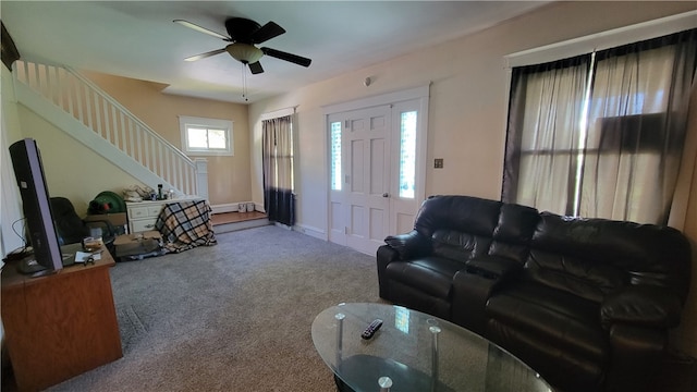 living room with ceiling fan and carpet flooring