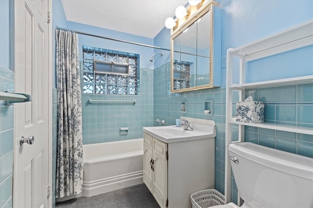 full bathroom with toilet, vanity, shower / bath combo, and tile walls