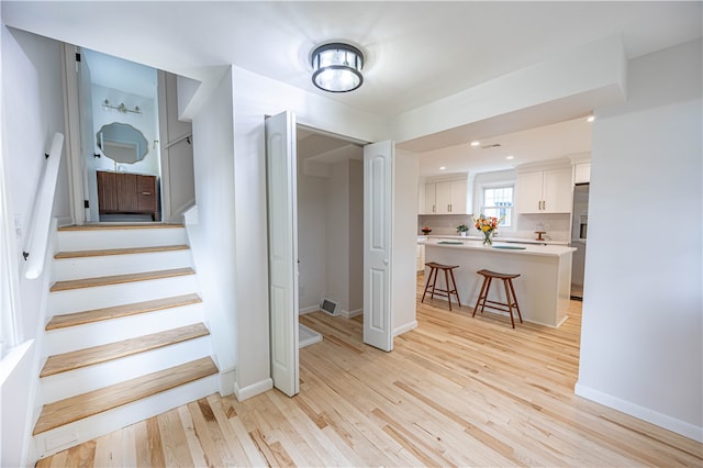 staircase featuring hardwood / wood-style floors