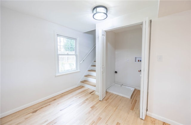 stairs with hardwood / wood-style flooring