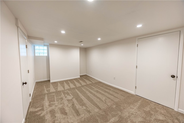 basement with light colored carpet