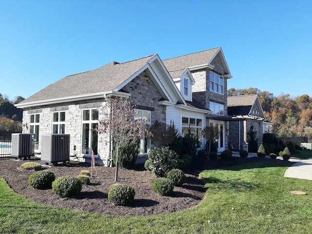 17 Carolina Ave, Oakmont, PA 15139 - view of front facade with stone siding and a front lawn