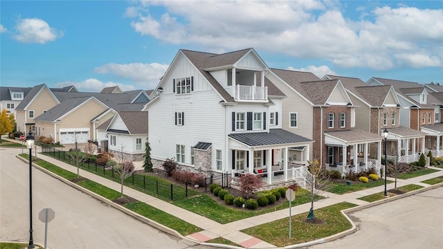 17 Carolina Ave, Oakmont, PA 15139 - view of front of home with board and batten siding, a residential view, a balcony, and a porch