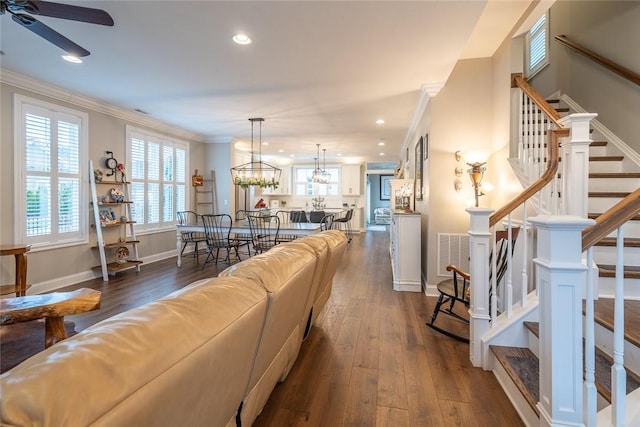 17 Carolina Ave, Oakmont, PA 15139 - living room with ornamental molding, dark wood finished floors, recessed lighting, stairs, and ceiling fan