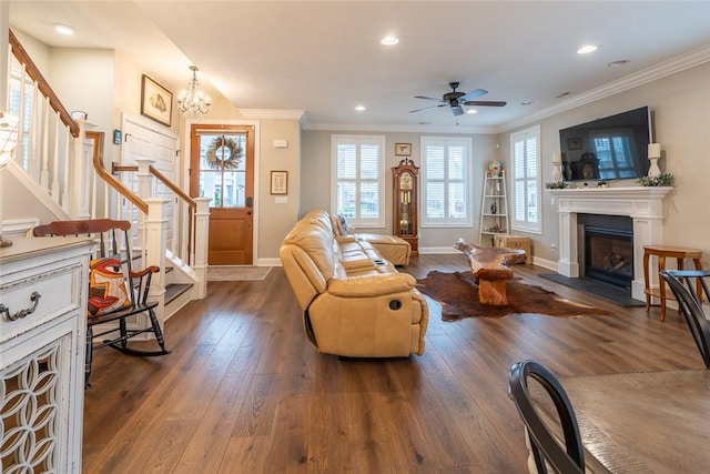 17 Carolina Ave, Oakmont, PA 15139 - living room featuring stairway, dark wood-style floors, a glass covered fireplace, a ceiling fan, and ornamental molding
