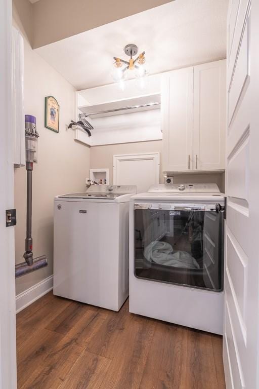 17 Carolina Ave, Oakmont, PA 15139 - washroom featuring cabinet space, washer and clothes dryer, and wood finished floors