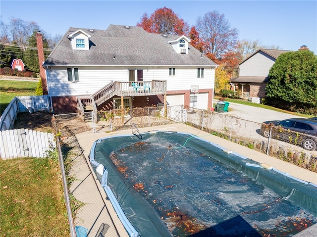 view of pool with a wooden deck