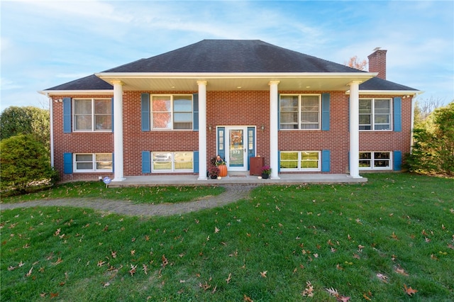 bi-level home with a front yard