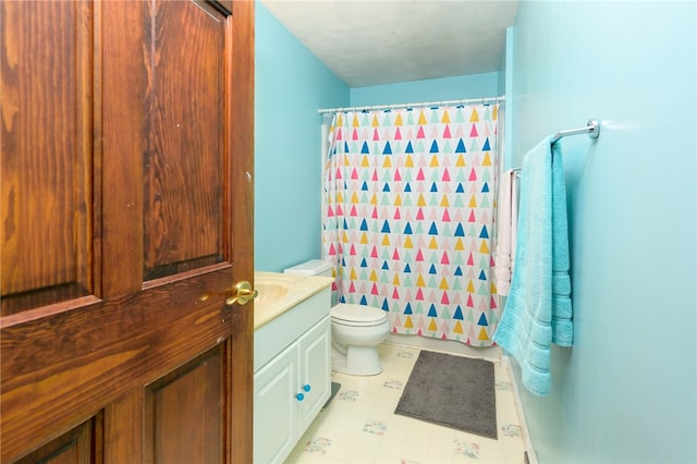 bathroom with vanity, toilet, and a shower with curtain