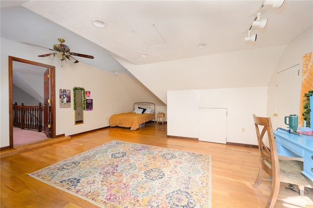 bonus room with wood-type flooring, ceiling fan, and vaulted ceiling