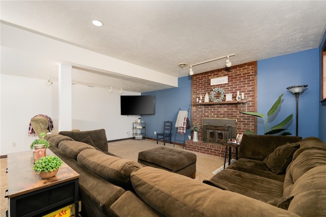 living room with a textured ceiling, track lighting, and carpet floors