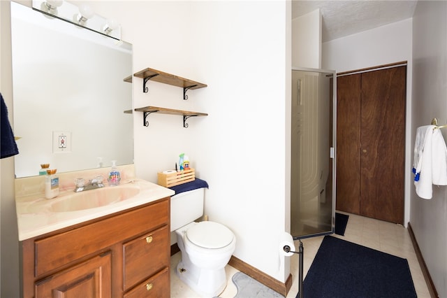 bathroom with toilet, vanity, and a textured ceiling