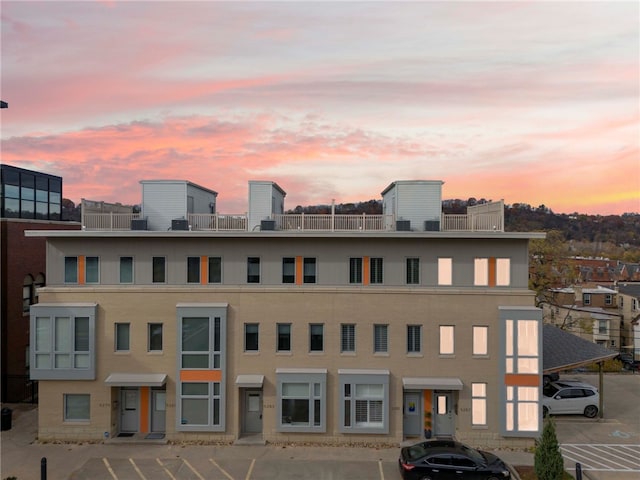 view of outdoor building at dusk