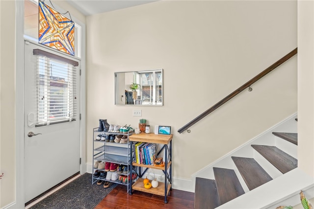 staircase with hardwood / wood-style flooring