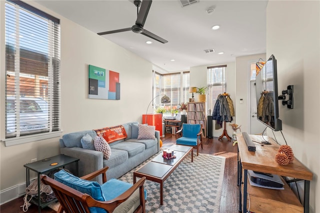 living room featuring hardwood / wood-style flooring and ceiling fan