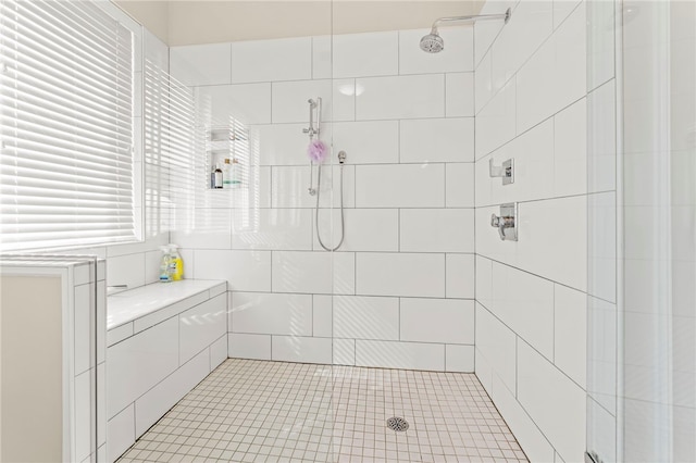 bathroom with a tile shower