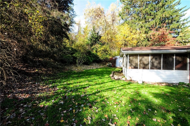 view of yard featuring a sunroom