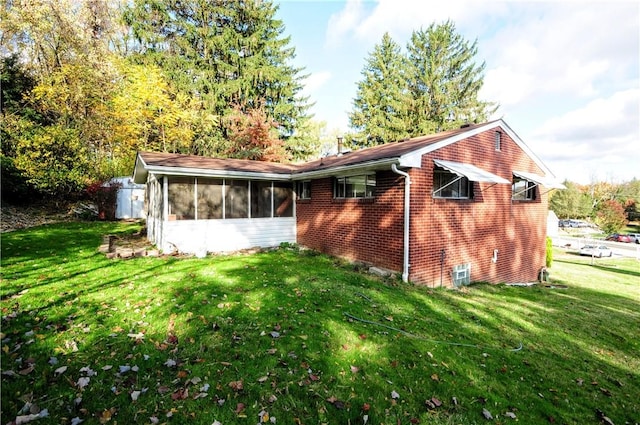 1011 Greenock Buena Vista Rd, Elizabeth Twp/Boro, PA 15135 - back of house with a sunroom, a yard, and brick siding
