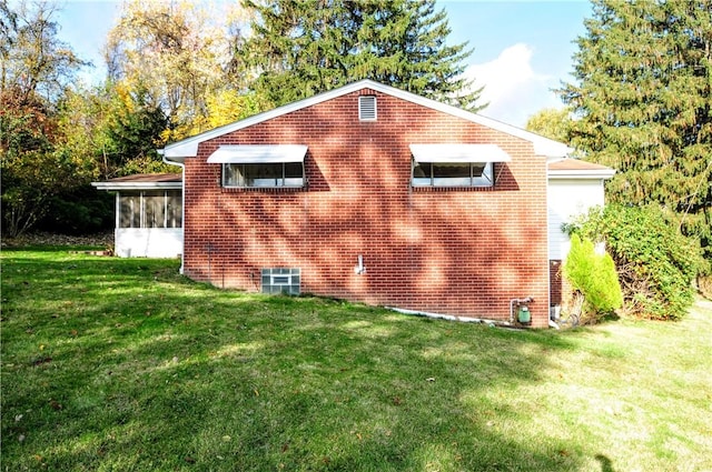 1011 Greenock Buena Vista Rd, Elizabeth Twp/Boro, PA 15135 - view of property exterior featuring a sunroom, a lawn, and brick siding