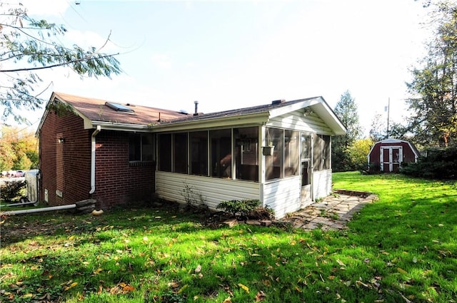 1011 Greenock Buena Vista Rd, Elizabeth Twp/Boro, PA 15135 - view of property exterior featuring brick siding, a sunroom, and a yard