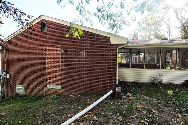 1011 Greenock Buena Vista Rd, Elizabeth Twp/Boro, PA 15135 - view of home's exterior with a sunroom and brick siding