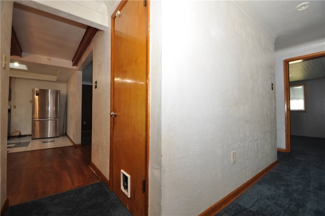 hallway featuring dark hardwood / wood-style flooring