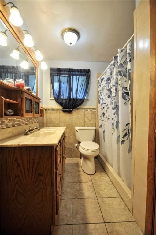 1011 Greenock Buena Vista Rd, Elizabeth Twp/Boro, PA 15135 - bathroom featuring toilet, tile patterned floors, vanity, tile walls, and a shower with curtain