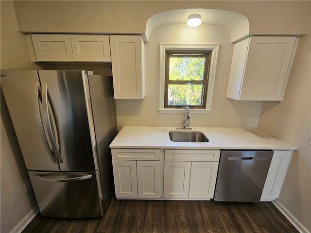 kitchen with white cabinetry, sink, dark hardwood / wood-style floors, and stainless steel appliances