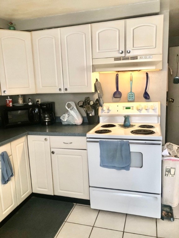 kitchen with white range with electric stovetop, white cabinetry, and light tile patterned floors