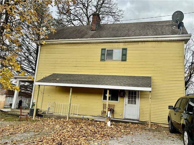 back of property with central AC