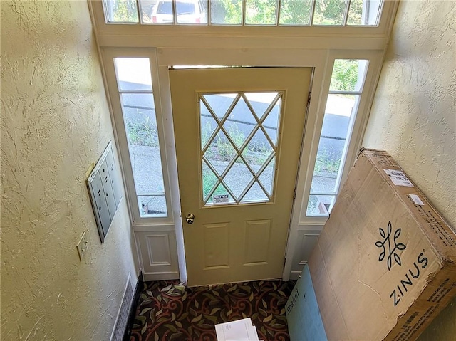 doorway featuring a textured wall