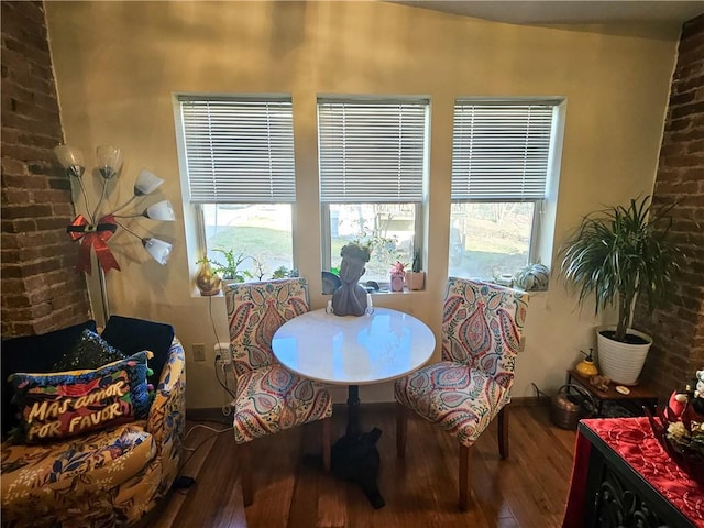 dining space with wood finished floors