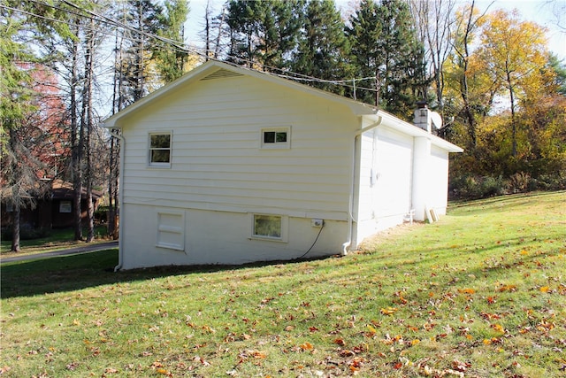 view of home's exterior with a yard