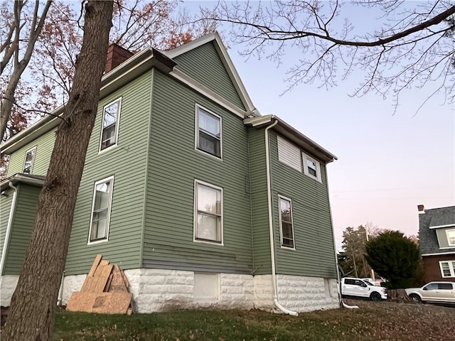 view of property exterior at dusk