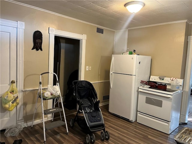 kitchen featuring dark hardwood / wood-style flooring, white appliances, and ornamental molding