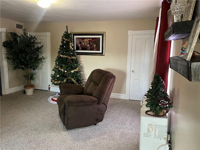 sitting room featuring carpet flooring