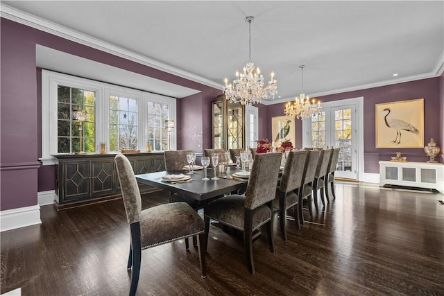 dining room with crown molding, dark wood-type flooring, a healthy amount of sunlight, and radiator heating unit