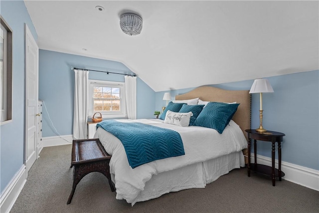 bedroom with carpet flooring and vaulted ceiling