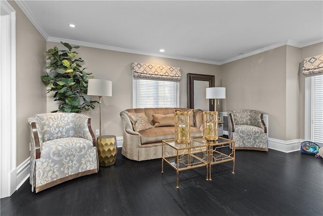 living room with wood-type flooring and ornamental molding