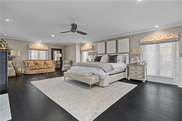 bedroom with ceiling fan, crown molding, and dark hardwood / wood-style floors