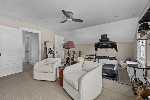 exercise area with carpet flooring, vaulted ceiling, and ceiling fan