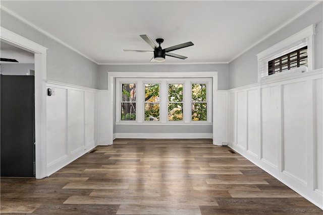 interior space featuring ceiling fan, dark hardwood / wood-style flooring, and ornamental molding