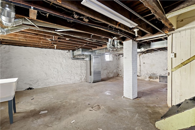 basement featuring heating unit