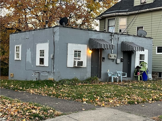 view of side of property with cooling unit