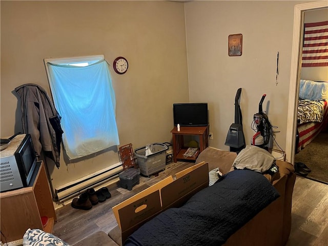 126 Park Ave, New Castle/2Nd, PA 16101 - interior space featuring a baseboard radiator and wood finished floors